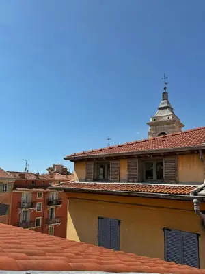a building with a tower on top of a roof at Studio Place Rossetti - Old Nice Center in Nice