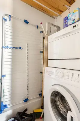 a washer and dryer in a laundry room with a window at Cosy 2 pieces au Coeur du Centre Ville in Nice