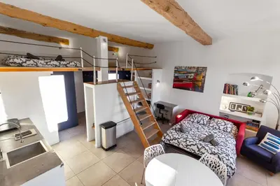 a living room with a bunk bed and a couch at Le Garibaldi - City centre - Bright - AC in Nice