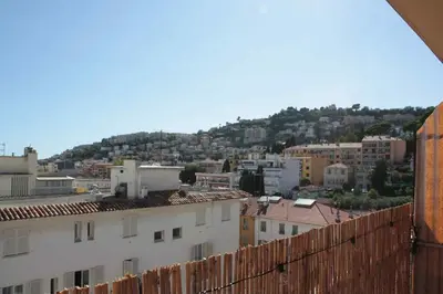 a view of a city with buildings and a hill at Le Cocon Niçois Studio Cozy et Lumineux avec Parking in Nice