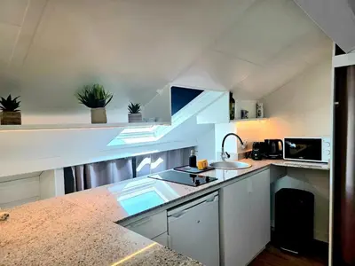 a kitchen with a sink and a counter top at Mansarde Lumineuse - Nice Gare 2 pers in Nice