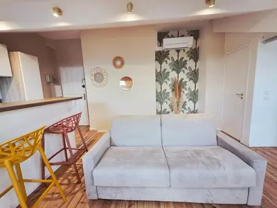 a living room with a couch and a bar at Design et confort - Nice Centre 4 pers in Nice