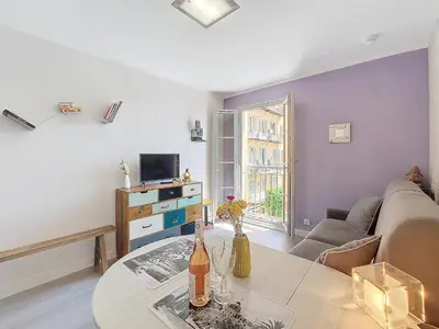 a living room with a couch and a table at Nestor&Jeeves - FIORI SALEYA - Old town - Close sea in Nice