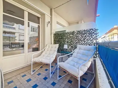 a balcony with two chairs and a table at Nestor&Jeeves - LADY BLUE - Terrace - Close sea in Nice