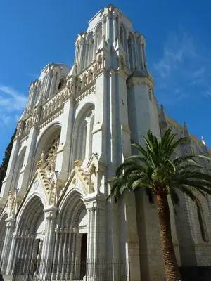 a building with a palm tree in front of it at 