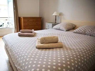 a bedroom with two beds with towels on them at 