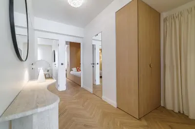 a hallway with a room with a bed and a mirror at Outstanding View on the Promenade - Awesome 2 Bdr in Nice
