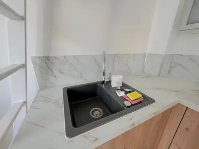 a kitchen counter with a sink in a counter top at ⁂ Petit nid design au centre de Nice in Nice