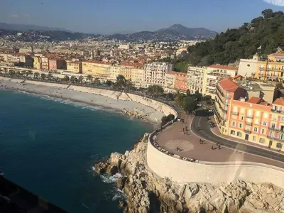 a view of a beach with buildings and the ocean at ⁂ Petit nid design au centre de Nice in Nice