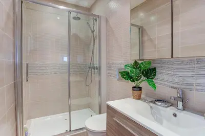 a bathroom with a shower and a toilet and a sink at NID MASSENA AP4486 by RIVIERA HOLIDAY HOMES in Nice