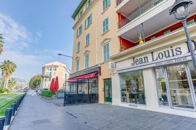 a building with a sign that reads jensen louis at NID MASSENA AP4486 by RIVIERA HOLIDAY HOMES in Nice