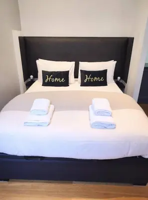 a bed with two pillows and towels on it at Studio in the heart of Nice close to amenities in Nice