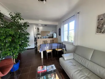 a living room with a couch and a table at Apartment nice view in Nice
