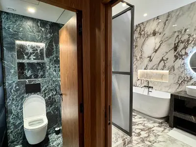 a bathroom with a toilet and a sink and a tub at Duplex design - Old Town 50 m from the sea in Villefranche-sur-Mer