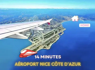an image of an airplane wing flying over a city at Charmant studio sur la Promenade des Anglais in Nice