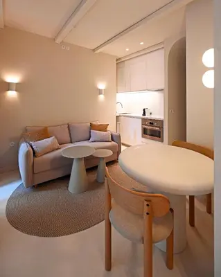 a living room with a couch and a table at Appartement d architecte - wifi, AC, 3 pers in Nice