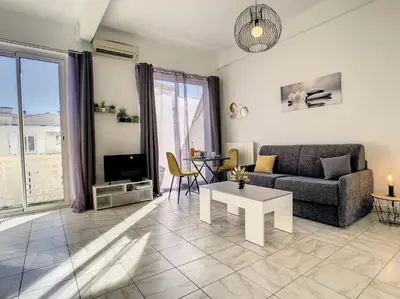 a living room with a couch and a table at Nestor&Jeeves - CITRONNIER AZUR - Central - Close sea in Nice
