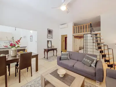 a living room with a couch and a table at Nestor&Jeeves - SQUARE PROMENADE - Central - Close sea in Nice