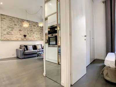 a living room with a mirror and a couch at Nestor&Jeeves - SWEET BEACH - Central - Near Beach in Nice