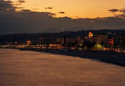 a view of a city with a river at sunset at Nestor&Jeeves - ROXANE - Near Negresco - Close Beach in Nice