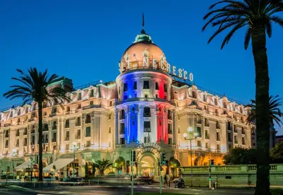 a building with blue and red lights on it at Nestor&Jeeves - ROXANE - Near Negresco - Close Beach in Nice