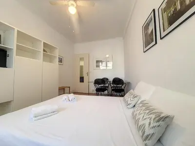 a white bedroom with a white bed and chairs at Nestor&Jeeves - ROXANE - Near Negresco - Close Beach in Nice