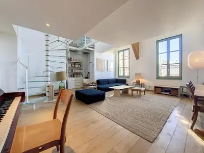 a living room with a blue couch and a piano at Nestor&Jeeves - NICE TO MEET YOU - Top floor - Central in Nice