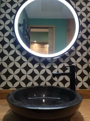 a bathroom with a black sink and a mirror at PASTO DROITE Appartement Nice 6P in Nice