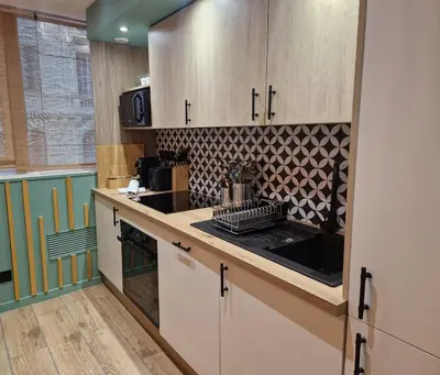 a kitchen with a sink and a stove top oven at PASTO GAUCHE Appartement Nice 6P in Nice