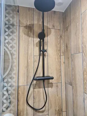 a black lamp in the corner of a room at PASTO GAUCHE Appartement Nice 6P in Nice