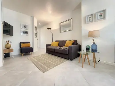 a living room with a couch and a table at Nestor&Jeeves - L ANCRE - Port Area - Close Old Town in Nice