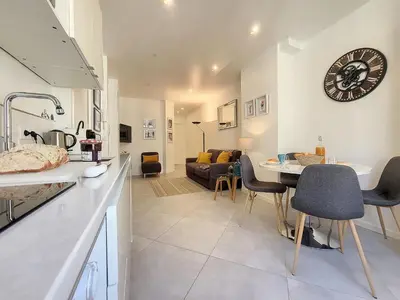 a kitchen and living room with a table and chairs at Nestor&Jeeves - L ANCRE - Port Area - Close Old Town in Nice