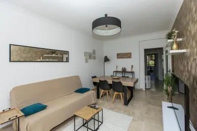 a living room with a couch and a table at Breathtaking panoramic view of Nice ! in Nice