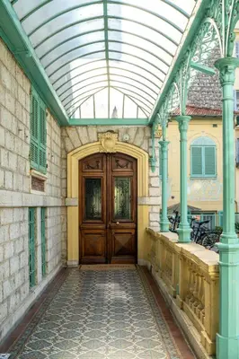 a building with a wooden door and a glass ceiling at Appartement Original cœur de ville -AC- in Nice