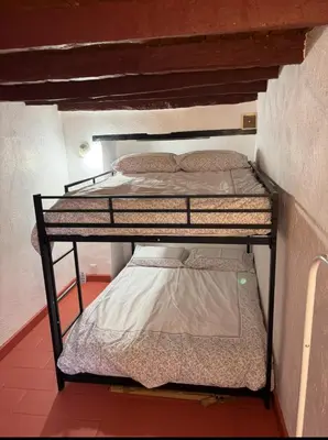 a couple of bunk beds in a room at Morning Coffee & Cobblestones - A True French Village Stay in Villefranche-sur-Mer