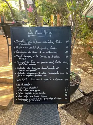 a chalkboard sign with writing on it in a garden at Pleine vue mer au calme - Parking, Piscine, Tennis in Nice