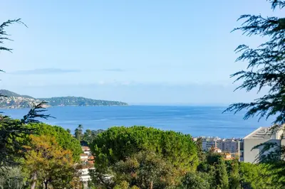a view of the ocean from a city at Pleine vue mer au calme - Parking, Piscine, Tennis in Nice