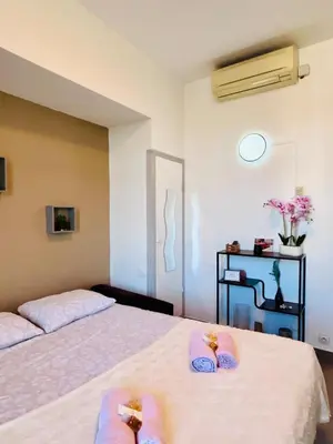 a bedroom with two beds with towels on them at Studio Rénové et Meublé Le Cœur de Nice à Vos Pieds in Nice