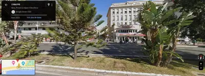 a view of a street with palm trees and buildings at studette a coté de la mer et la promenade in Nice