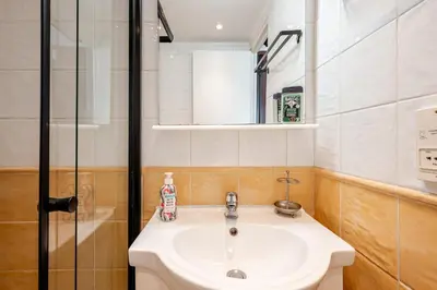 a bathroom with a sink and a mirror at studette a coté de la mer et la promenade in Nice