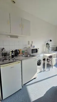a white kitchen with a sink and a dishwasher at LX144 Bright & refined studio WIFI Mobility lease in Nice