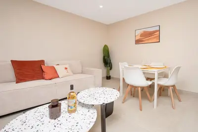 a living room with a couch and a table at Nice Saint Roch - Bel appartement rénové - EV in Nice