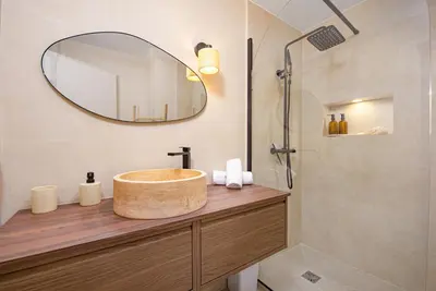 a bathroom with a sink and a mirror at Nice Saint Roch - Bel appartement rénové - EV in Nice