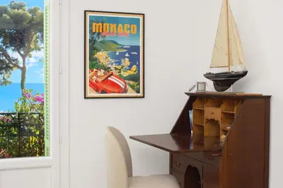 a room with a desk and a poster of a movie at Bord de mer - Beau 2 pièces rénové - Parking - EX in Èze