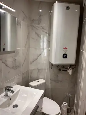 a bathroom with a white sink and a toilet at Bottero nice in Nice