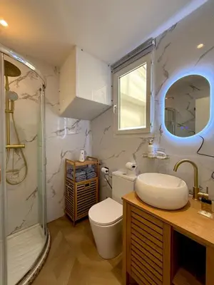 a bathroom with a sink and a toilet and a shower at Beachfront Appartment Nice Promenade des anglais 2 terraces in Nice