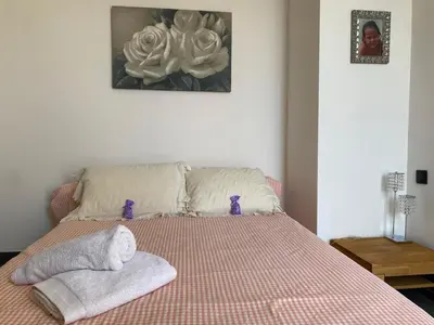 a bedroom with a bed with two towels on it at Beautiful 2 rooms 45 m2 Nice in Nice