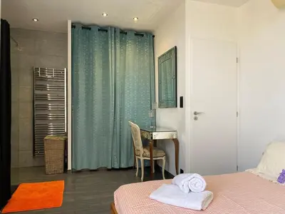 a bedroom with a bed and a desk and a table at Beautiful 2 rooms 45 m2 Nice in Nice