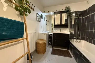 a bathroom with a bath tub and a sink and a bath tub at Cozy apartment in the heart of Nice in Nice