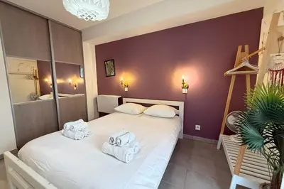 a bedroom with two beds with towels on them at Cozy apartment in the heart of Nice in Nice
